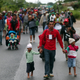 Migrants walk along the highway to Isla from Sayula de Aleman, Mexico on Nov. 3.